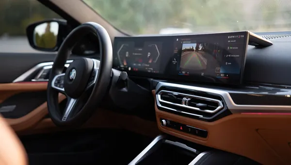 Modern automotive dashboard with digital displays showcasing E/E architecture